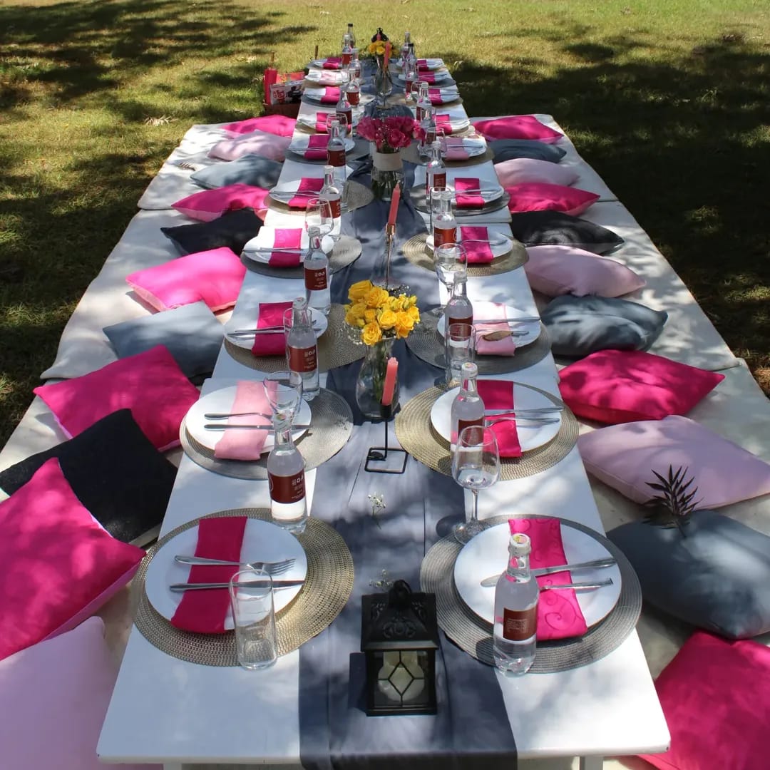 Luxury boho kids picnic setup with bouncing castle, teepee and balloon decor in Nairobi